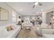 Spacious living room with an open layout flowing into the kitchen, perfect for modern living at 5651 Nw 40Th Pl, Ocala, FL 34482