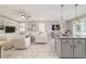 Open floor plan of living and dining area with views of kitchen and living room with custom built-ins at 5651 Nw 40Th Pl, Ocala, FL 34482
