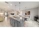 Open floor plan of living and dining area with views of kitchen and living room with custom built-ins at 5651 Nw 40Th Pl, Ocala, FL 34482