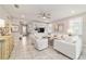 Comfortable living room with tile flooring, built-in shelving, and lots of natural light at 5651 Nw 40Th Pl, Ocala, FL 34482