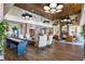 Spacious lobby area with comfortable seating, fireplace, shuffleboard table, and elegant decor at 5651 Nw 40Th Pl, Ocala, FL 34482