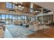 A view of the clubhouse lobby with ample seating, modern lighting fixtures and views of the golf course at 5651 Nw 40Th Pl, Ocala, FL 34482