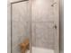 The large walk-in shower offers a bench seat and elegant tilework at 5651 Nw 40Th Pl, Ocala, FL 34482