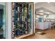 Wine cellar next to the kitchen, featuring a glass door and abundant bottles of wine at 5651 Nw 40Th Pl, Ocala, FL 34482