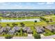Elevated aerial view of houses backing onto golf course and pond; planned community surrounded by greenery at 6683 Sw 97Th Terrace Rd, Ocala, FL 34481