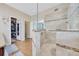 This bathroom features a glass walk-in shower with tile accents and a separate toilet room at 6683 Sw 97Th Terrace Rd, Ocala, FL 34481