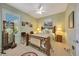 Cozy bedroom with a comfortable bed, decorative pillows, and a ceiling fan at 6683 Sw 97Th Terrace Rd, Ocala, FL 34481