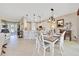 Inviting dining area with modern chandelier adjacent to updated kitchen at 6683 Sw 97Th Terrace Rd, Ocala, FL 34481
