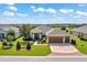 Beautiful single-story home boasts lush landscaping, a three-car garage, and a well-maintained lawn at 6683 Sw 97Th Terrace Rd, Ocala, FL 34481