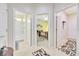 The hallway has tile floors and multiple doorways leading to the bedrooms and bathrooms at 6683 Sw 97Th Terrace Rd, Ocala, FL 34481