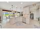 Well-lit kitchen with stainless steel appliances, granite countertops, and ample cabinet space at 6683 Sw 97Th Terrace Rd, Ocala, FL 34481