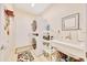Functional laundry room with a stacked washer and dryer and utility sink at 6683 Sw 97Th Terrace Rd, Ocala, FL 34481