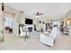 Cozy living room with fireplace, tile floors, and neutral decor, perfect for relaxing at 6683 Sw 97Th Terrace Rd, Ocala, FL 34481