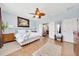 This light and airy main bedroom has hardwood floors and an ensuite bathroom at 6683 Sw 97Th Terrace Rd, Ocala, FL 34481