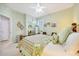 Comfortable main bedroom with a floral comforter and sunny, shuttered windows at 6683 Sw 97Th Terrace Rd, Ocala, FL 34481