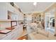Bright office space with a cozy armchair and built in shelving and cabinets at 6683 Sw 97Th Terrace Rd, Ocala, FL 34481