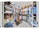 This walk-in closet is designed to maximize space with metal shelving and custom organization at 6683 Sw 97Th Terrace Rd, Ocala, FL 34481