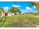 A well manicured backyard featuring a grassy area, a fence, and a shed at 6989 Se 52Nd Pl, Ocala, FL 34472