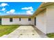 Concrete patio extends from the home, perfect for outdoor dining and relaxation at 6989 Se 52Nd Pl, Ocala, FL 34472