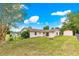 Spacious backyard with a shed, great for outdoor activities and storage on a sunny day at 6989 Se 52Nd Pl, Ocala, FL 34472