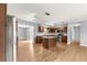 Open kitchen with a center island, stainless steel appliances, and a seamless flow to the dining area at 6989 Se 52Nd Pl, Ocala, FL 34472