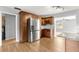 Modern kitchen featuring stainless steel appliances, rich wood cabinetry, and granite countertops at 6989 Se 52Nd Pl, Ocala, FL 34472