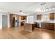 Spacious kitchen with stainless steel appliances, granite countertops, and wood cabinets at 6989 Se 52Nd Pl, Ocala, FL 34472