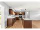 Bright kitchen showcasing stainless steel appliances, granite counters, and a functional island at 6989 Se 52Nd Pl, Ocala, FL 34472