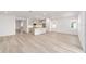 Open-concept living room and kitchen area with modern design elements at 7203 Sw 86Th Ave, Ocala, FL 34481