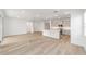 Spacious living area flowing into a modern kitchen with a large island at 7203 Sw 86Th Ave, Ocala, FL 34481