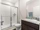 Bathroom featuring a shower with glass doors, granite countertop, and dark wood cabinets at 8142 Sw 59Th Ave, Ocala, FL 34476