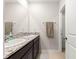 Bright bathroom featuring a double sink vanity with granite countertop and modern fixtures at 8142 Sw 59Th Ave, Ocala, FL 34476