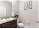 Neutral bathroom with granite countertop, decorative print, and flower accent at 8142 Sw 59Th Ave, Ocala, FL 34476