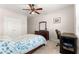 Comfortable bedroom with carpet, a ceiling fan, and a large dresser at 8142 Sw 59Th Ave, Ocala, FL 34476
