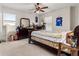 Bedroom with light walls, ceiling fan, and view of neighborhood at 8142 Sw 59Th Ave, Ocala, FL 34476