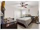 Bedroom with dark furniture, ceiling fan, and plenty of natural light at 8142 Sw 59Th Ave, Ocala, FL 34476
