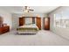 Large bedroom features neutral carpet, ceiling fan, and lots of built-in cabinets and storage space at 8142 Sw 59Th Ave, Ocala, FL 34476