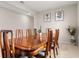 Formal dining room showcasing a polished wood table with eight chairs and neutral walls at 8142 Sw 59Th Ave, Ocala, FL 34476