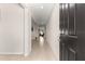 Bright hallway featuring neutral walls and tile flooring offering a glimpse into the home's layout at 8142 Sw 59Th Ave, Ocala, FL 34476