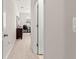 Upstairs hallway featuring carpet flooring with an office visible through a partially open door at 8142 Sw 59Th Ave, Ocala, FL 34476