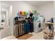 Laundry room with washer, dryer, and shelving for storage at 8142 Sw 59Th Ave, Ocala, FL 34476