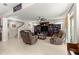 Open-concept living room with comfortable seating, entertainment center, and neutral decor at 8142 Sw 59Th Ave, Ocala, FL 34476