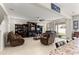 Spacious living room with comfortable seating, ceiling fan, and sliding glass doors to the patio at 8142 Sw 59Th Ave, Ocala, FL 34476
