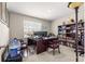 Home office space with a large desk, comfortable leather chairs, and built-in bookshelves at 8142 Sw 59Th Ave, Ocala, FL 34476