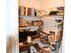 Photo of a very cluttered closet with desk, books and boxes at 8321 Sw 108Th Place Rd, Ocala, FL 34481