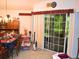 Bright dining area with sliding glass doors to the patio and traditional furnishings at 8321 Sw 108Th Place Rd, Ocala, FL 34481