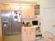 Bright kitchen featuring modern stainless steel appliances and ample cabinet space at 8321 Sw 108Th Place Rd, Ocala, FL 34481