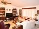 Cozy living room featuring carpet floors and multiple seating options at 8321 Sw 108Th Place Rd, Ocala, FL 34481
