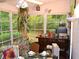 Cozy sunroom with large windows and a view of the greenery outside at 8321 Sw 108Th Place Rd, Ocala, FL 34481