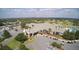 Aerial view of the community clubhouse, parking, and pool at 8961 Se 130Th Loop, Summerfield, FL 34491